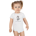 Child wearing a white onesie with a colorful graphic and text on a white background
