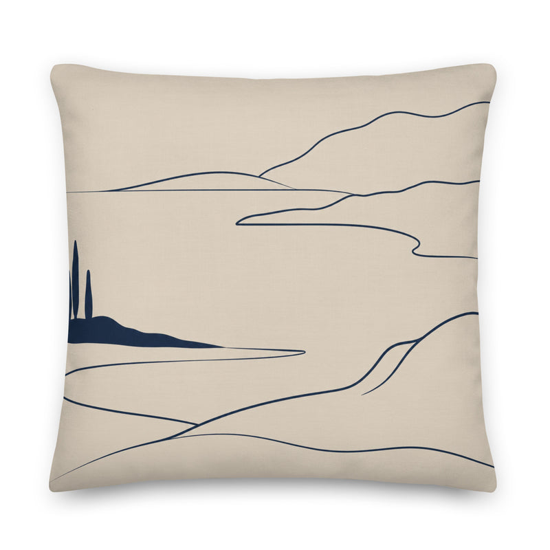 Beige pillow with abstract black line art design on a white background