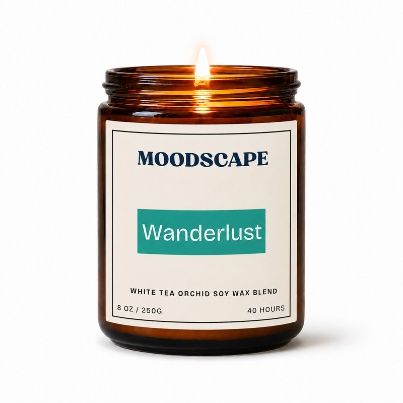 Moodscape Wanderlust candle in an amber jar on a white background