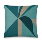 Decorative pillow with geometric pattern in teal and brown on a white background
