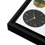 Framed clock with black face and gold hands on a white background