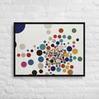 Framed artwork with colorful dot pattern on a white brick wall