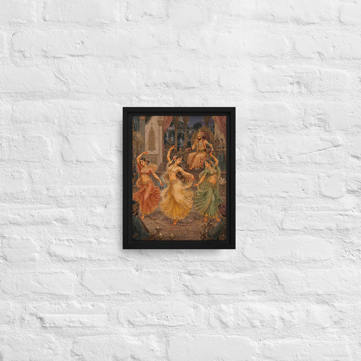 Framed artwork of dancers on a white brick wall
