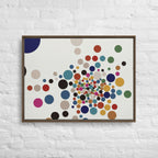 Framed artwork with colorful dot pattern on a white brick wall