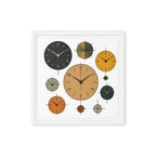 Framed artwork with multiple clock faces in different colors on a white background