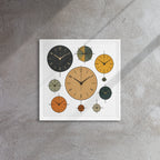 Decorative wall clock with multiple clock faces on a gray wall