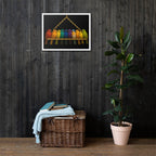 Wicker basket with folded clothes next to a potted plant against a dark wooden wall.