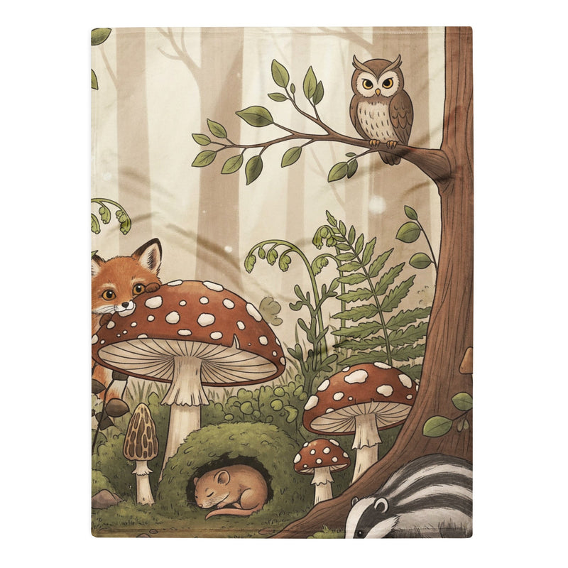 Baby blanket with cottage core vibe in woodland setting including baby fox, owl, mushrooms and trees